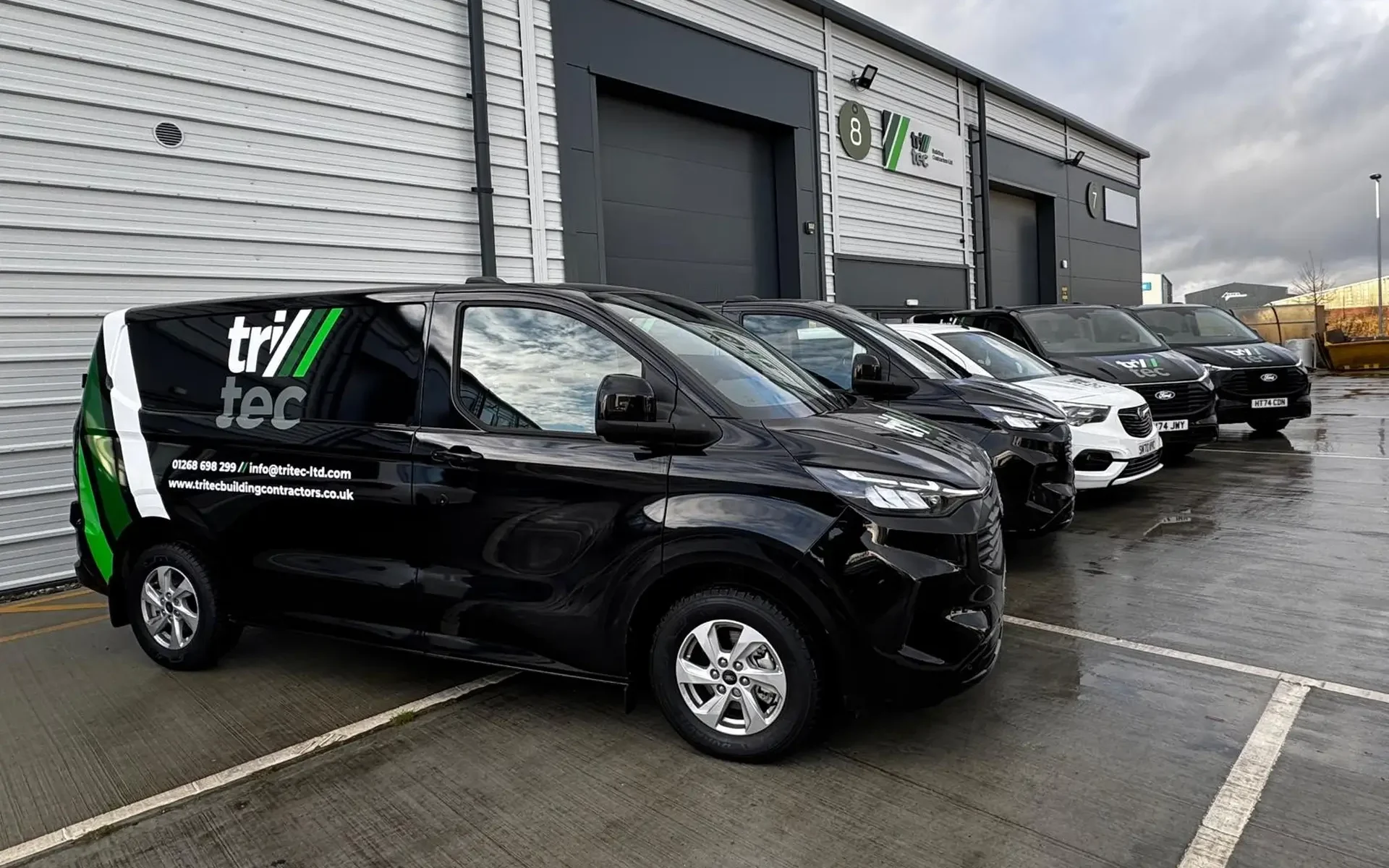Tritec Company Vans Parked In Line